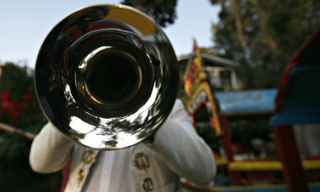 A mariachi plays his trumpet on the outskirts of Mexico City