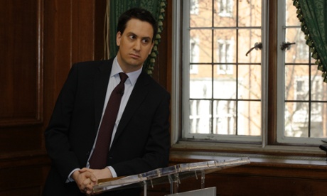 In this file photo, Britain's Labour party leader Ed Miliband listens to the shadow chancellor speaking to the media calling for the budget in London.