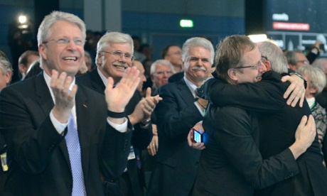 Celebrating at mission control in Darmstadt (from left to right) Esa director Thomas Reiter, Johann-Dietrich Woerner, chair of the supervisory board of the German Space and Aeronautics Agency, and Esa director general Jean-Jacques Dordain.
