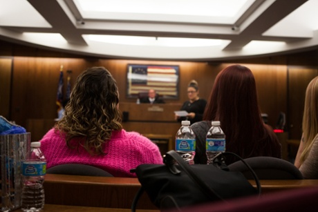 Andrea (left), a branded sex trafficking survivor who got her tattoo covered by survivors Ink, attends a CATCH court session in Columbus, Ohio.