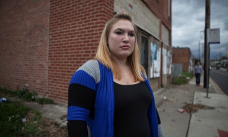 Jennifer Kempton, 32, a sex trafficking survivor, stands in a street corner where she used to be trafficked and work as a prostitute in The Bottoms, Columbus, Ohio. Kempton, who left heroin addiction and the trafficking situation a year and a half ago, is the creator of Survivors Ink, a project that helps other sex trafficking survivors cover their trafficking brandings. Ohio Trafficking Tattoos