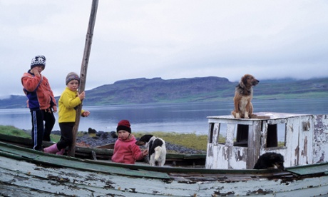 Children playing on a fishing boat