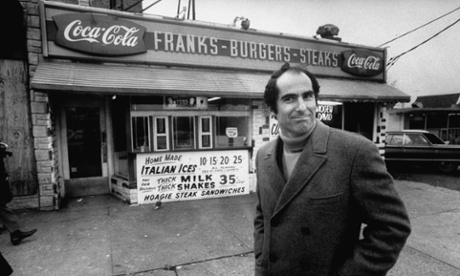 The author Philip Roth revisits areas where he grew up in Newark, standing at hamburger stand.