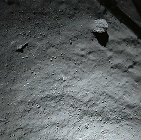 This image was taken by the ROLIS camera on Philae when it was 40 metres above the surface. It suggests a very loose, dusty surface.