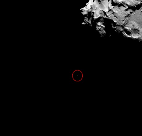 In this new image released by Esa, the circled speck is the Philae lander during its descent. The picture was taken by Rosetta's OSIRIS wide-angle camera at 14:19:22 GMT on Wednesday.