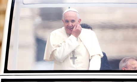 Pope Francis arrives in St. Peter's square for his weekly audience on November 12, 2014.