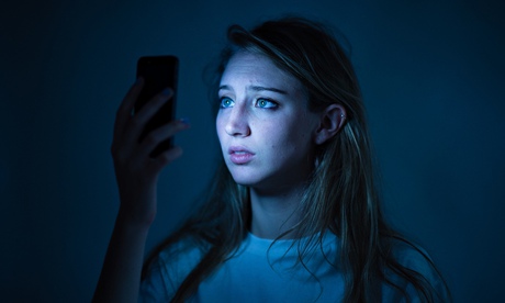 Young woman smartphone looking worried about cyber bullying