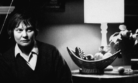 British author Iris Murdoch photographed at home in 1960.