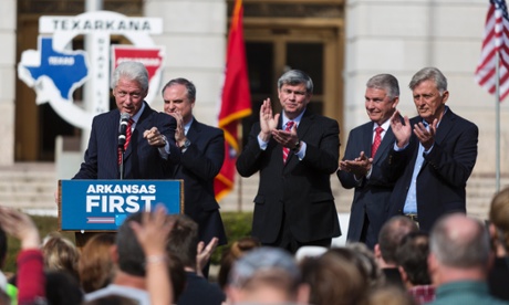 Governor Mike Beebe, far right, at a speech by Bill Clinton.