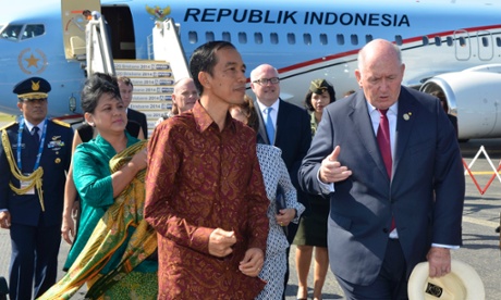 President of Indonesia Joko Widodo walks with Governor-General of Australia Sir Peter Cosgrove after his arrival in Brisbane.