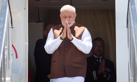 Modi gesturing arrives in Brisbane for the G20 summit.