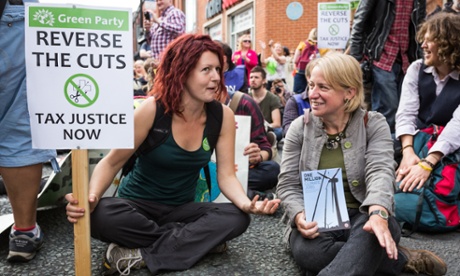 Laura Bannister of the Green Party talking to Natalie Bennett, leader of the Green party, at a demonstration in Manchester.