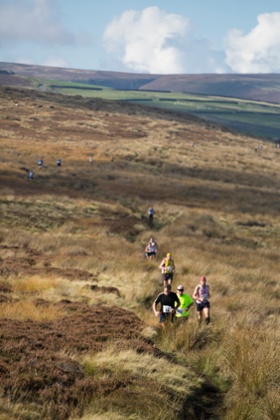 Racers make their way through peat bogs and heather in the Withins Skyline event.