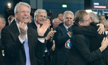 From left to right, ESA director Thomas Reiter, Johann-Dietrich Woerner, chair of the supervisory board of the German Space and Aeronautics Agency (DLR), and ESA general director Jean-Jacques Dordain celebrate.