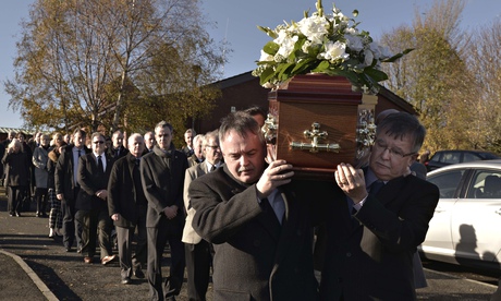 Brendan Megraw's brothers carry his coffin at his funeral in Belfast