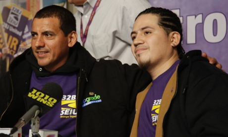 Juan Lizama, left, and co-worker Juan Lopez pose for a photo after answering questions during a news conference 14 November 2014 in New York.