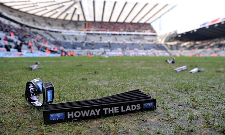 A Wonga banner on the pitch after the match between Newcastle United and Sunderland