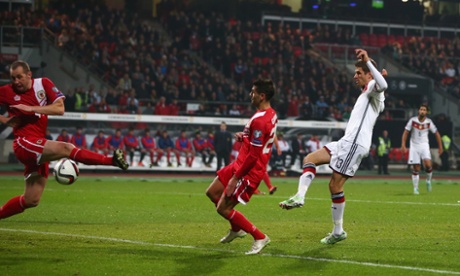 Thomas Mueller scores the opener against Gibraltar at Grundig Stadion in Nuremberg.