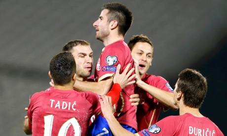 Zoran Tosic celebrates after scoring for Serbia in Belgrade.