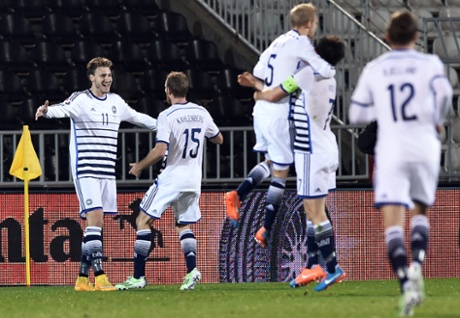 Nicklas Bendtner celebrates with his Danish teammates.