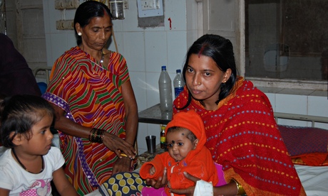 Shivkumari Yadav sits with daughters Prisha, two months, Mansi, three, and her mother Mahasin Bai