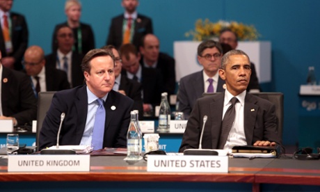 BRISTANE, AUSTRALIA - NOVEMBER 15: U.S. President Barack Obama (R) and British Prime Minister David Cameron attend the opening session of the G20 Summit on November 15, 2014 in Brisbane, Australia.