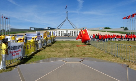 Protesters gather outside Parliament House in Canberra, Monday, Nov. 17, 2014. The Chinese President Xi Jinping, who attended the G20 Leaders Summit in Brisbane, will be delivering an address to the Australian parliament today.
