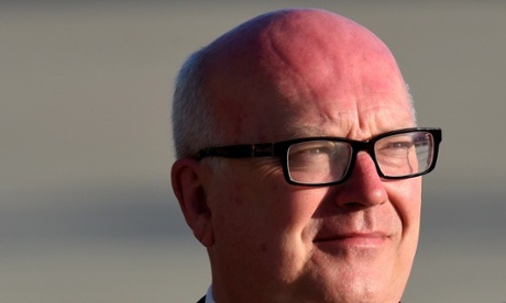 A sunburned Attorney-General George Brandis waits for US President Barack Obama to arrive at RAAF Base Amberley in Brisbane, Saturday, Nov. 15, 2014. World economic are in Brisbane to attend the G20 Leadership Summit on November 15-16. (AAP Image/Lukas Coch) NO ARCHIVINGNewsCurrent AffairsPoliticsPoliticalPoliticianPoliticians