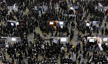 Jobseekers attend a job fair held for graduates in Tokyo, Japan 