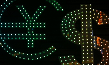 Illuminated dollar and yen signs at a bureau de change