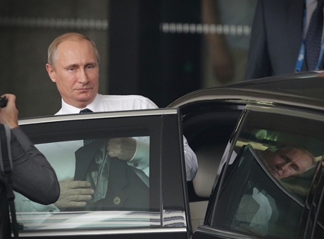 Russian President Vladimir Putin leaves the Hilton Hotel in Brisbane, Queensland for the airport after attending the G20 leaders' summit.