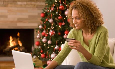 Woman and christmas tree with laptop. 