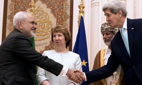 U.S. Secretary of State John Kerry, right, and Iranian Foreign Minister Mohammad Javad Zarif, shake hands during a meeting in Muscat, Oman, Sunday, Nov. 9, 2014. Omani Foreign Minister Yussef bin Alawi bin Abdullah and European Union High Representative Catherine Ashton stand at background.
