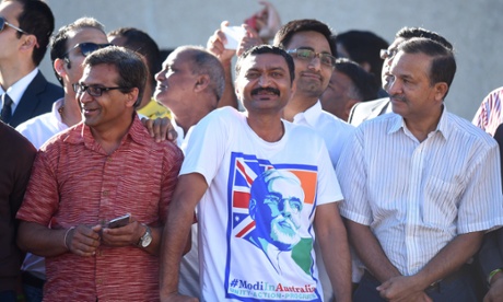 Supporters of Indian Prime Minister Narendra Modi wait for his arrival to receive a ceremonial welcome at Parliament House in Canberra, Tuesday, Nov. 18, 2014.