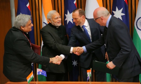 The Prime Minister of the Republic of India Narendra Modi and Prime Minister Tony Abbott with the secretary (East) for the Ministry of External Affairs Anil Wadhwa and Arts Minister George Brandis at the signing of an MOU in Parliament House Canberra this morning, Tuesday 18th November 2014.