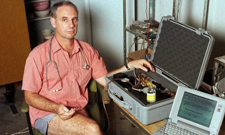 Dr Philip Nitschke in his office in June 1996 with his euthanasia delivery system, which comprised a lap-top computer and a box containing a syringe which was connected to the patient by intravenous line and driven by compressed air. The equipment was labelled 'The Death Machine'.  Dr Nitschke assisted in the second legal suicide in Darwin on 2 January 1997, of Janet Mills, 52, who suffered from terminal skin cancer.