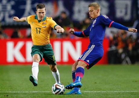 Keisuke Honda and Australia's Matt McKay.