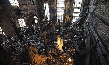 Owen Godbert, a forensic archaeologist, surveys the debris after the fire at Mackintosh's library
