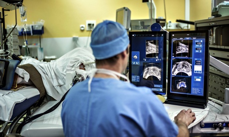 A surgeon performs a robot-assisted prostate tumorectomy. 