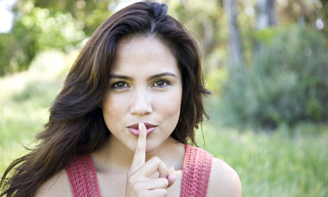 woman with finger on lips 