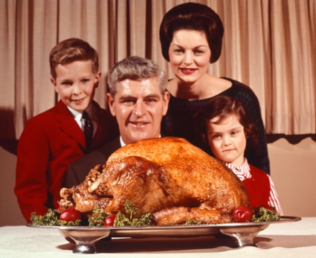 A 1950s American family with a huge turkey.
