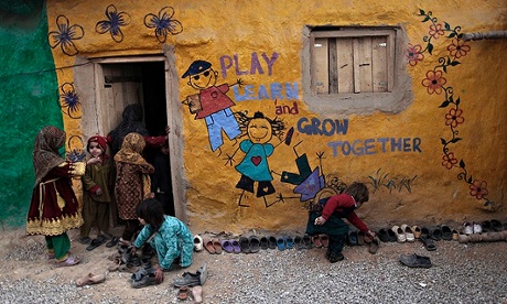 MDG : Child rights : Pakistani schoolchildren enter a classroom in school, Pakistan