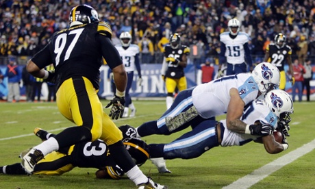 Tennessee Titans offensive tackle Taylor Lewan (77) falls into the end zone on top of running back Bishop Sankey against Pittsburgh.