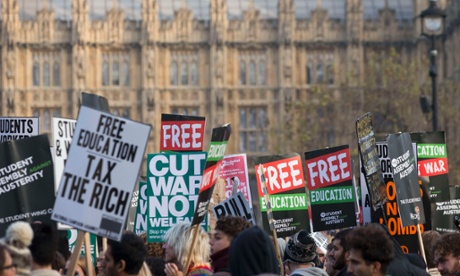 Demonstrators pass the Houses of Parliament during a protest in favour of free education.