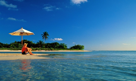 Man on beach in Cayman Islands
