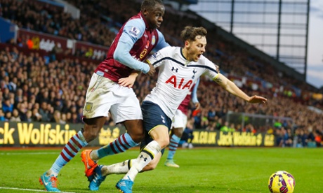 Aly Cissokho brings down Ryan Mason as the Spurs midfielder dribbles along the byline towards goal.