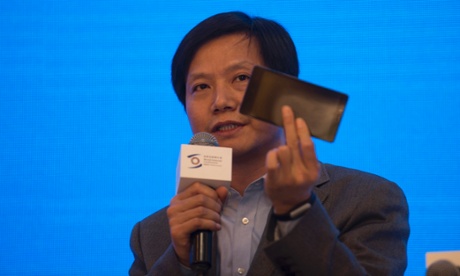Xiaomi's Lei Jun holding a smartphone