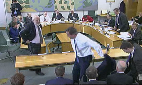 David Cameron leaving the committee