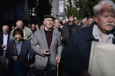 Greek pensioners march in central Athens on November  20, 2014, to protest against harsh austerity measures and pension cuts.