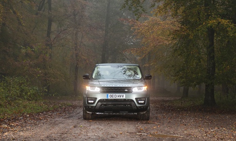 range rover on wooded road